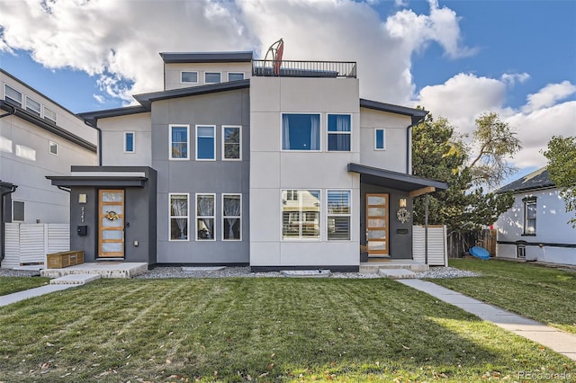 contemporary home featuring a front yard