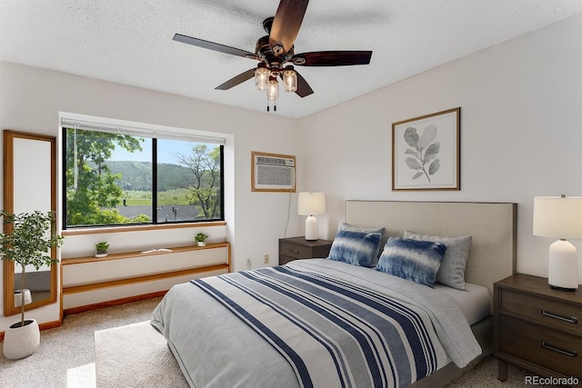 2960 W Stuart St Unit 302, Fort Collins, CO 80526 - carpeted bedroom featuring a wall unit AC and a ceiling fan