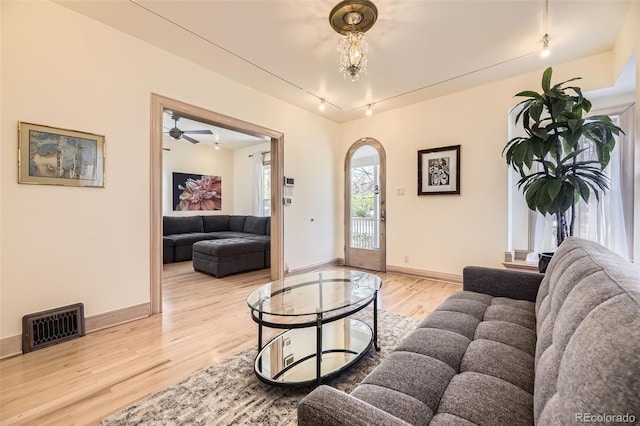 826 Maxwell Ave, Boulder, CO 80304 - living area with track lighting, baseboards, light wood finished floors, and visible vents