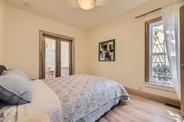 826 Maxwell Ave, Boulder, CO 80304 - bedroom featuring light wood-style floors, french doors, and visible vents