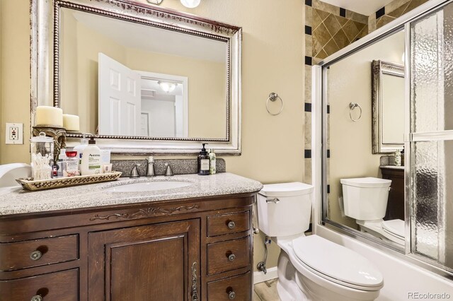 1973 S Pitkin St, Aurora, CO 80013 - bathroom with toilet, a shower with shower door, and vanity