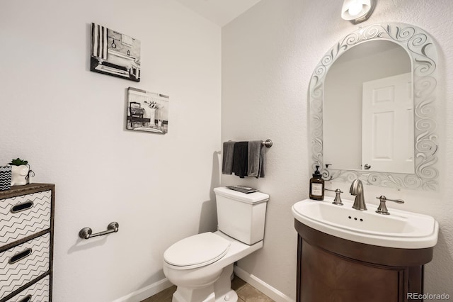 1973 S Pitkin St, Aurora, CO 80013 - half bath featuring toilet, vanity, and baseboards