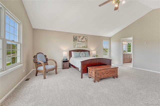bedroom featuring connected bathroom, baseboards, visible vents, and light carpet