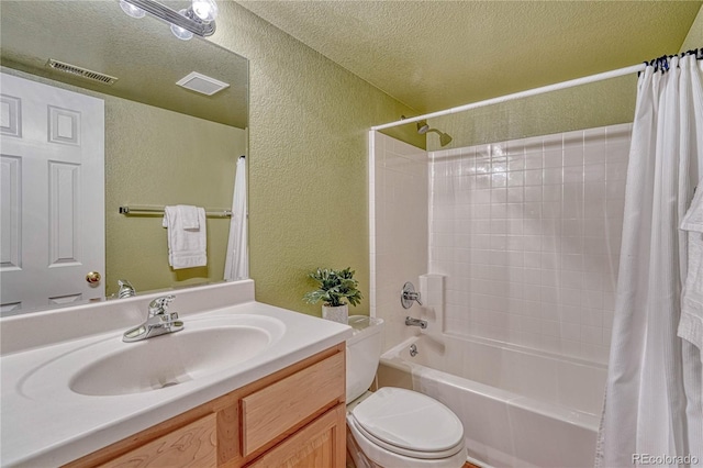 full bath featuring visible vents, a textured ceiling, a textured wall, and toilet