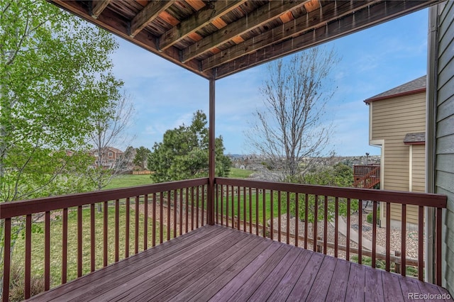 wooden deck with a lawn