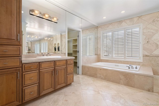 full bathroom with a bath, a walk in closet, vanity, and crown molding