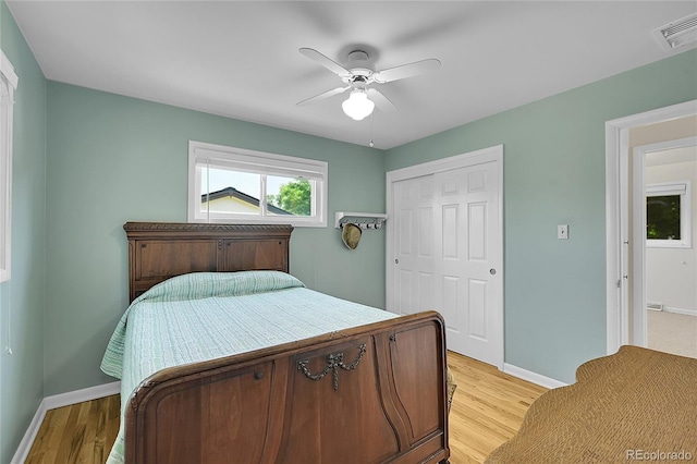 5047 S Mabre Ct, Littleton, CO 80123 - bedroom with a closet, light wood finished floors, and a ceiling fan