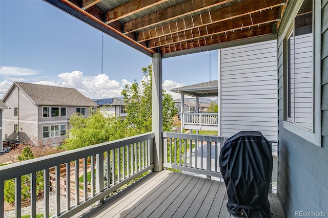 wooden deck featuring a residential view