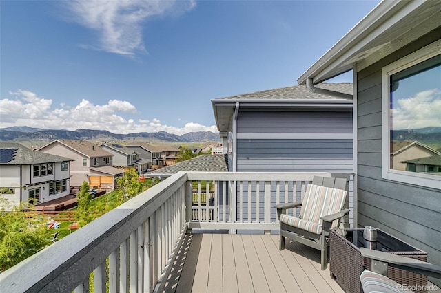 wooden terrace with a mountain view and a residential view
