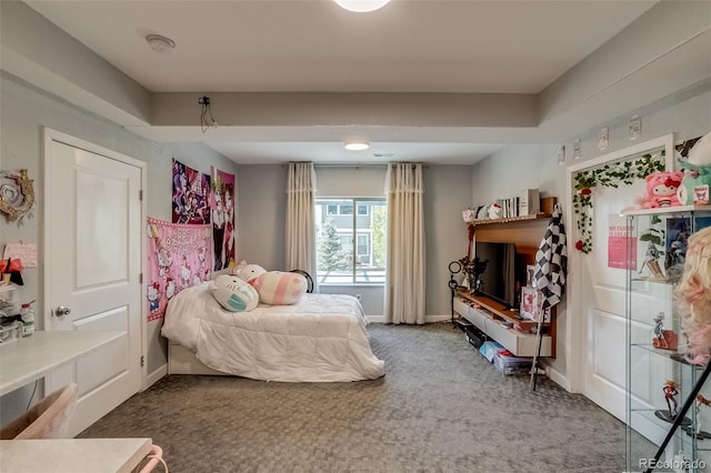 carpeted bedroom with baseboards