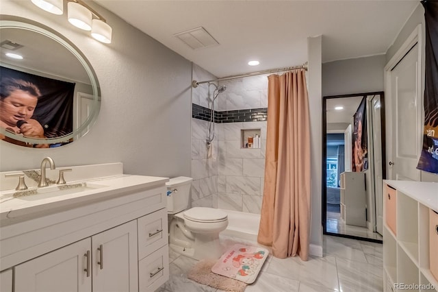 full bathroom featuring marble look tiles, toilet, tiled shower, and vanity