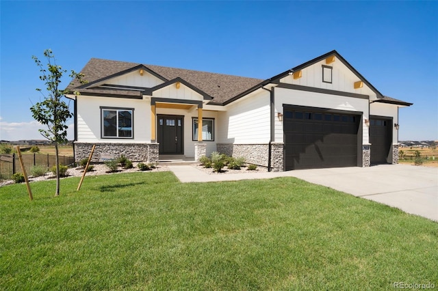 modern inspired farmhouse with concrete driveway, fence, a garage, stone siding, and a front lawn