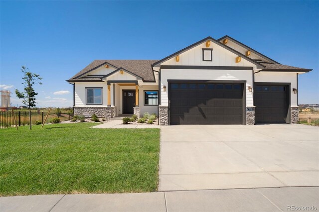 view of front facade featuring a garage and a front lawn