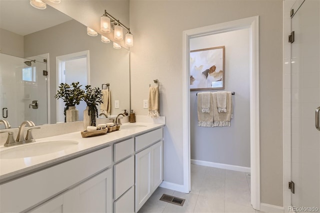 6807 Huddersfield Ln, Castle Pines, CO 80108 - full bathroom featuring double vanity, visible vents, a shower stall, and a sink