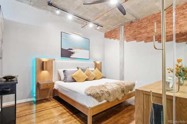 1720 Wazee St Unit 2B, Denver, CO 80202 - bedroom featuring track lighting, wood finished floors, and ceiling fan