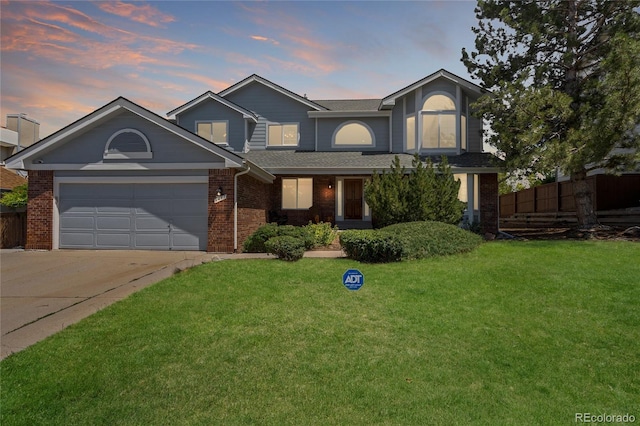 9447 Chesapeake St, Highlands Ranch, CO 80126 - traditional-style house with brick siding, concrete driveway, an attached garage, and a shingled roof