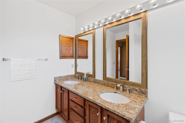 9447 Chesapeake St, Highlands Ranch, CO 80126 - bathroom with double vanity and baseboards
