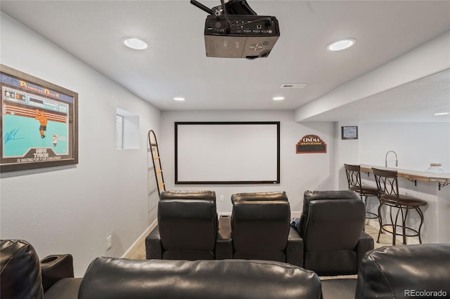 9447 Chesapeake St, Highlands Ranch, CO 80126 - carpeted home theater featuring recessed lighting and bar with sink
