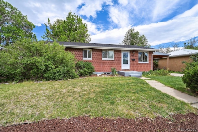 1646 S Stuart St, Denver, CO 80219 - ranch-style home featuring brick siding and a front lawn