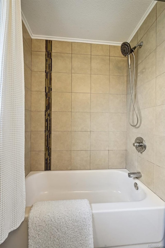 1646 S Stuart St, Denver, CO 80219 - full bathroom with ornamental molding, shower / bath combo, and a textured ceiling