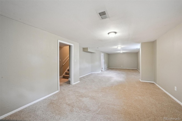 1646 S Stuart St, Denver, CO 80219 - unfurnished room with light colored carpet, stairway, and baseboards