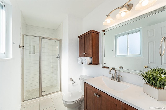 full bathroom with a stall shower, baseboards, toilet, tile patterned flooring, and vanity