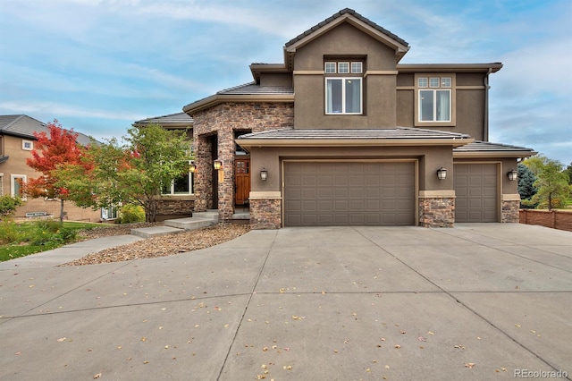 14022 E Fair Pl, Centennial, CO 80111 - prairie-style house featuring stone siding, stucco siding, a garage, concrete driveway, and a tile roof