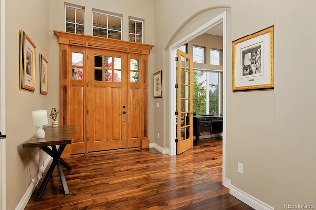 14022 E Fair Pl, Centennial, CO 80111 - entryway featuring dark wood-style flooring, baseboards, and a towering ceiling