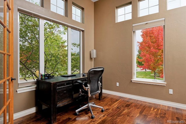 14022 E Fair Pl, Centennial, CO 80111 - office area with baseboards, wood finished floors, and a high ceiling
