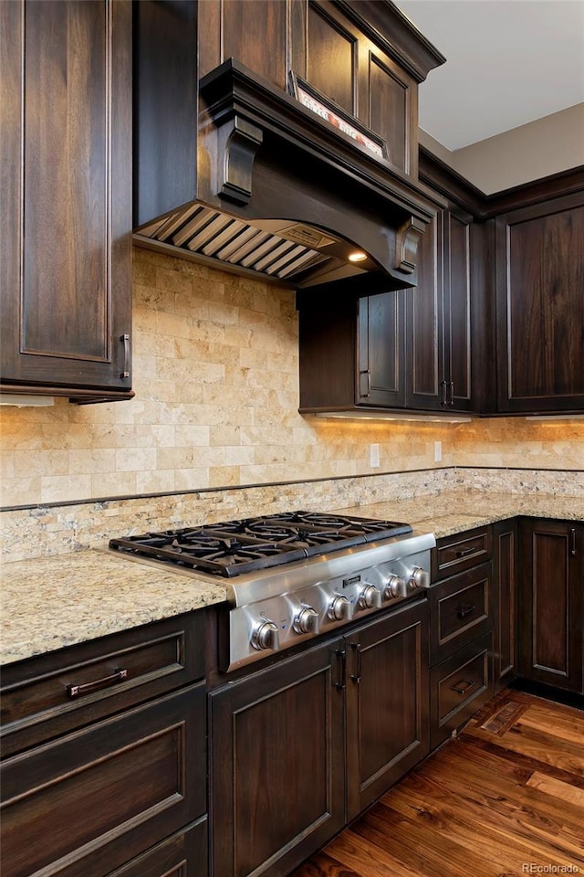 14022 E Fair Pl, Centennial, CO 80111 - kitchen featuring stainless steel gas cooktop, range hood, and dark brown cabinetry