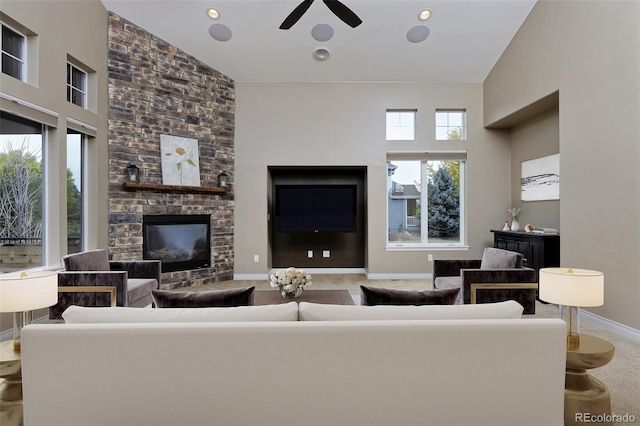 14022 E Fair Pl, Centennial, CO 80111 - living area featuring a large fireplace, high vaulted ceiling, a ceiling fan, baseboards, and carpet flooring