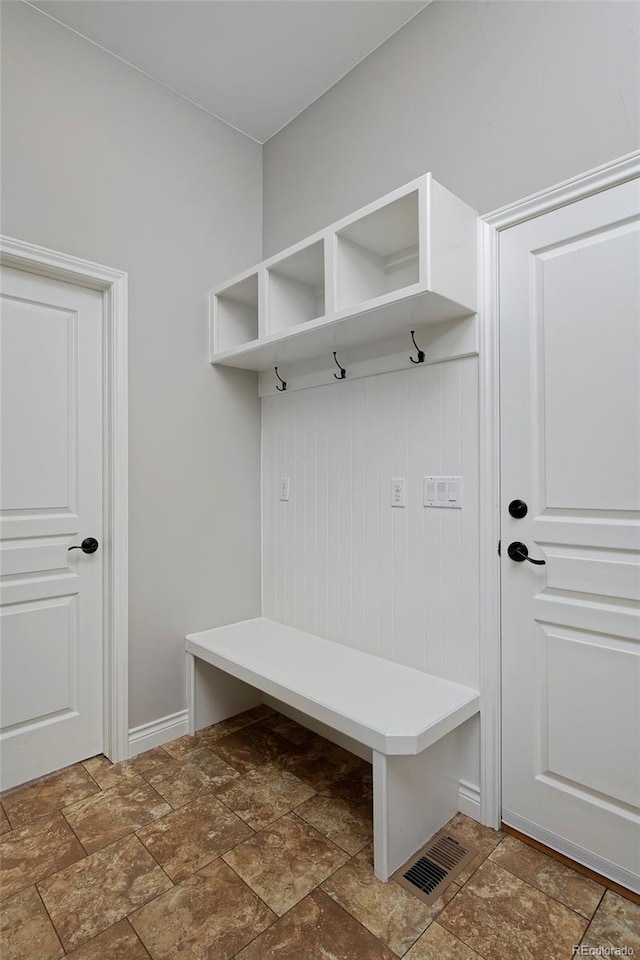 14022 E Fair Pl, Centennial, CO 80111 - mudroom with stone finish flooring and baseboards