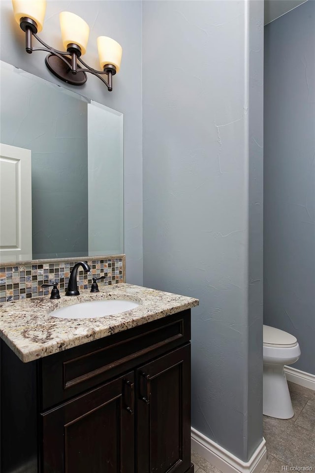 14022 E Fair Pl, Centennial, CO 80111 - bathroom with vanity, toilet, and baseboards