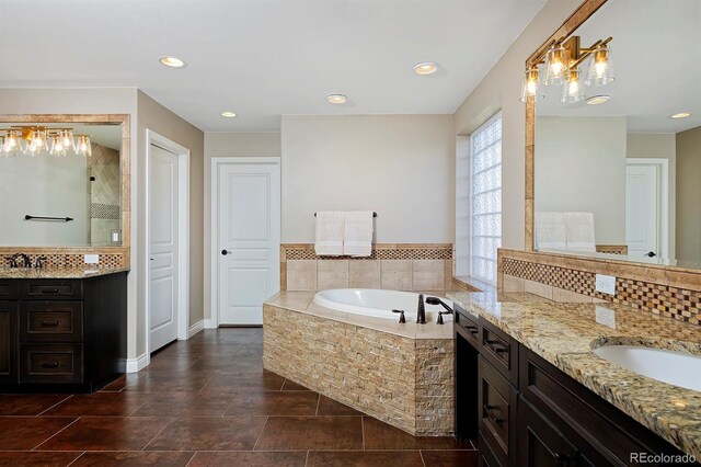 14022 E Fair Pl, Centennial, CO 80111 - full bath with a garden tub, two vanities, baseboards, and recessed lighting