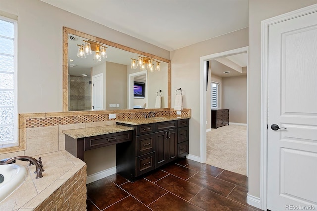 14022 E Fair Pl, Centennial, CO 80111 - bathroom with vanity, a garden tub, baseboards, a tile shower, and tile patterned floors