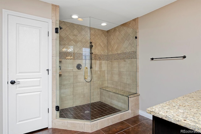 14022 E Fair Pl, Centennial, CO 80111 - bathroom with vanity, a stall shower, baseboards, tile patterned flooring, and recessed lighting