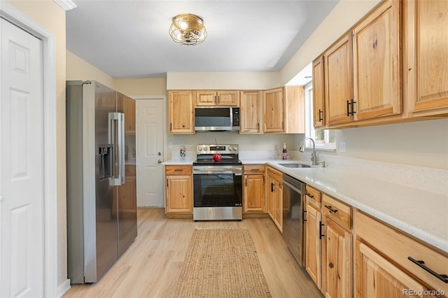 4589 S Sleepy Hollow Cir, Colorado Springs, CO 80917 - kitchen with appliances with stainless steel finishes, light wood finished floors, and light countertops
