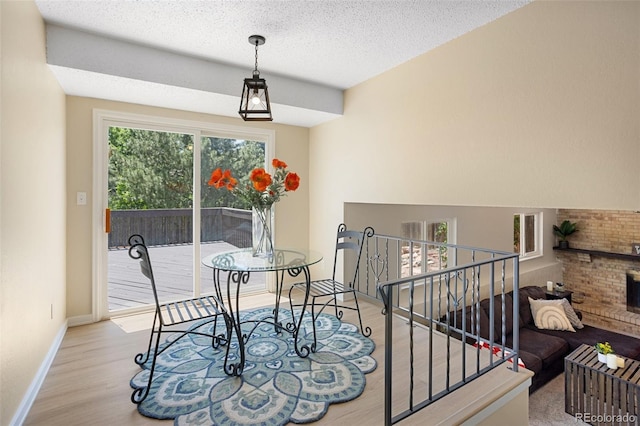 4589 S Sleepy Hollow Cir, Colorado Springs, CO 80917 - dining space with wood finished floors and a textured ceiling