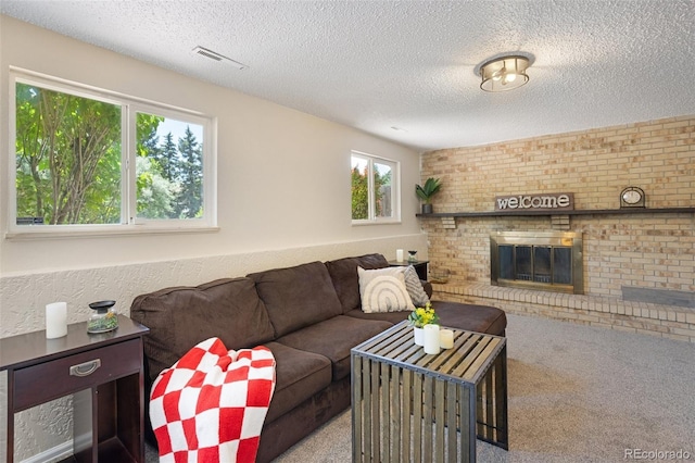 4589 S Sleepy Hollow Cir, Colorado Springs, CO 80917 - carpeted living area featuring a textured ceiling and a brick fireplace