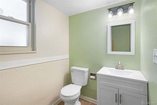 4589 S Sleepy Hollow Cir, Colorado Springs, CO 80917 - half bath with vanity and wood finished floors