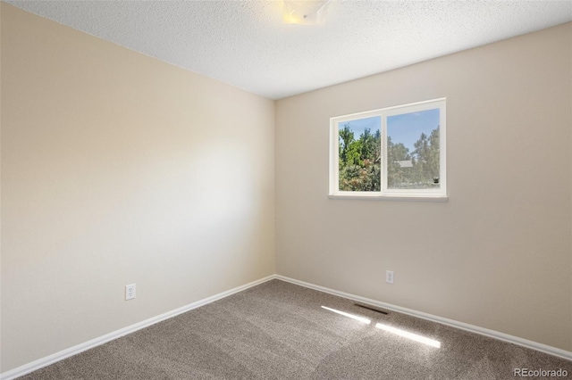 4589 S Sleepy Hollow Cir, Colorado Springs, CO 80917 - carpeted spare room featuring baseboards and a textured ceiling