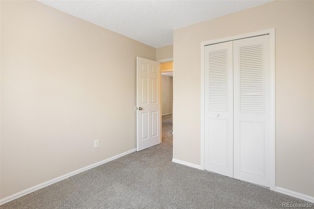 4589 S Sleepy Hollow Cir, Colorado Springs, CO 80917 - unfurnished bedroom featuring carpet flooring, a closet, and a textured ceiling