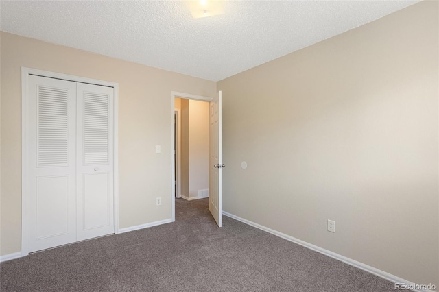 4589 S Sleepy Hollow Cir, Colorado Springs, CO 80917 - unfurnished bedroom with a closet, carpet floors, and a textured ceiling