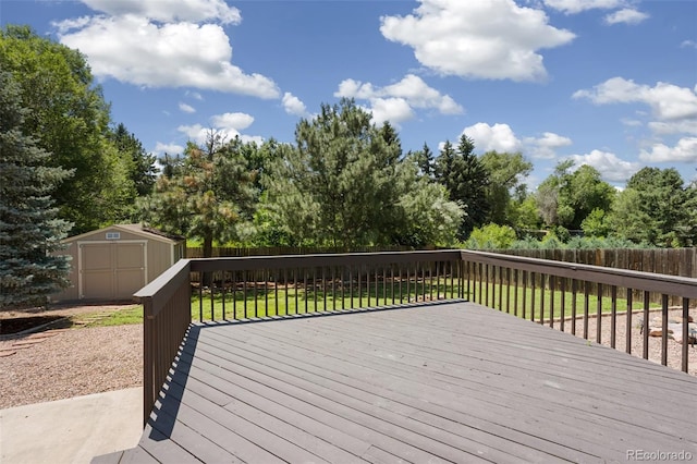 4589 S Sleepy Hollow Cir, Colorado Springs, CO 80917 - deck featuring a storage unit, a fenced backyard, and view of scattered trees