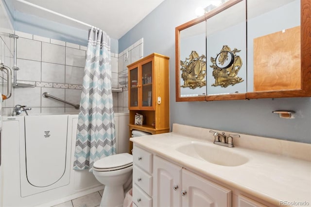 1922 Graves Ct, Northglenn, CO 80233 - full bathroom with vanity, tile patterned flooring, and shower / bath combo