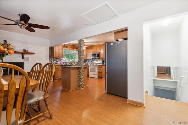 1922 Graves Ct, Northglenn, CO 80233 - dining room with light wood-style floors, attic access, and a ceiling fan