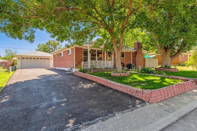 1922 Graves Ct, Northglenn, CO 80233 - ranch-style home featuring brick siding, an outbuilding, and a front yard