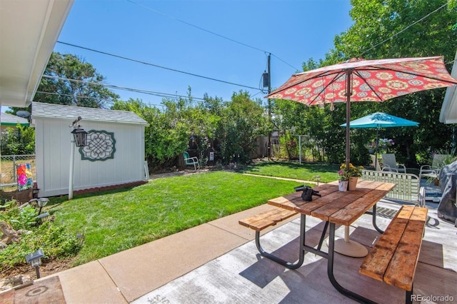 1922 Graves Ct, Northglenn, CO 80233 - fenced backyard with an outbuilding, outdoor dining space, and a patio