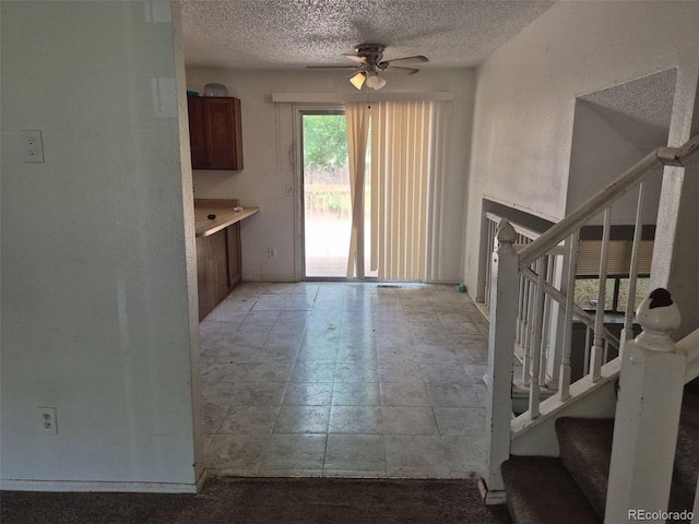 18249 E Mexico Pl, Aurora, CO 80017 - interior space with stairs, ceiling fan, and a textured ceiling