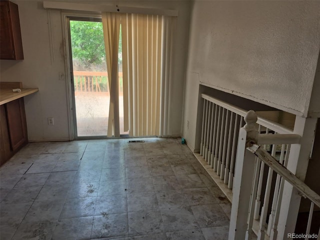18249 E Mexico Pl, Aurora, CO 80017 - unfurnished dining area with baseboards